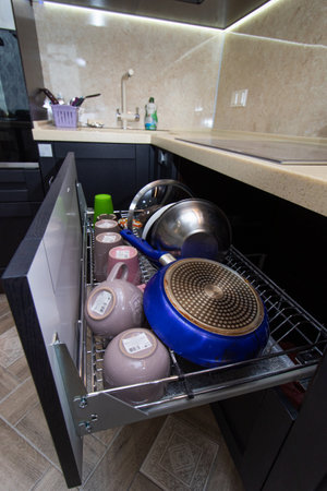 Modern kitchen made of solid black. The kitchen is of solid oak. details. Modern kitchen furniture filling. Furniture to order. The design of the apartment. The black kitchen. Furniture. Russia, Saint Petersburg, new building, April 15, 2020のeditorial素材