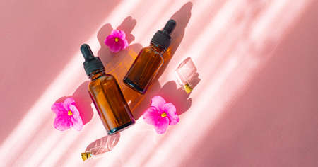 Cosmetic oil and a flower. Cosmetic procedures.の写真素材