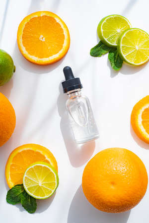 Hyaluronic acid and citrus fruits. Cosmetic procedures. Healthy skin. Skin care. Citrus oil. White background. Copy space. Article about care cosmeticsの写真素材