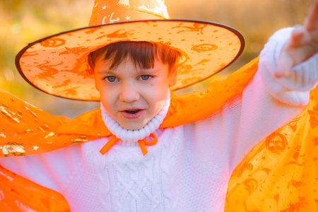 Portrait of a boy in Halloween clothes on the street. A traditional holiday. October 31. Autumn Holidayの写真素材