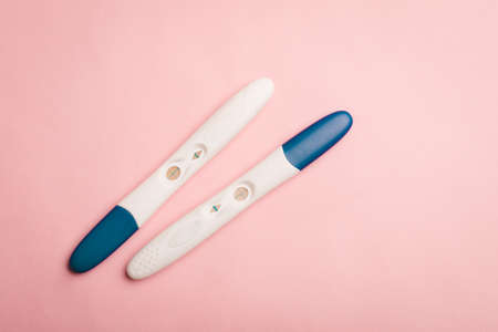 Pregnancy test on a pink background. Positive test. Pregnancy copy space. Motherhoodの写真素材