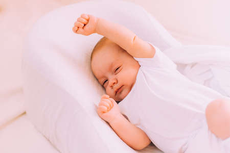 The baby stretches after sleeping Lifestyle . A happy child. children's article. copy spaceの写真素材