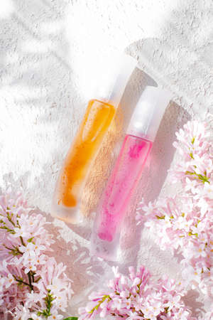 Perfume bottles with flowers. The choice of fragrance. Cosmetology. cosmetic products. An article...