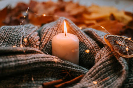 Autumn leaves and candles. cozy vibes. Autumn article. Printed products autumn.の写真素材