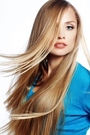 Portrait of young beautiful woman with long strong blond hair Portrait of young beautiful woman with long strong blond hair