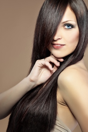 Portrait of young beautiful woman with long glossy hairの写真素材