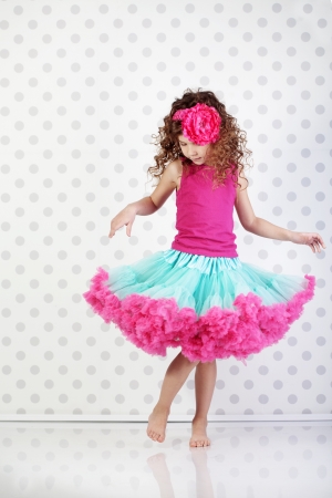 Studio portrait of cute little princess wearing beautiful tutu skirtの写真素材