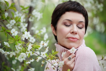 Portrait of beautiful middle aged woman in springの写真素材