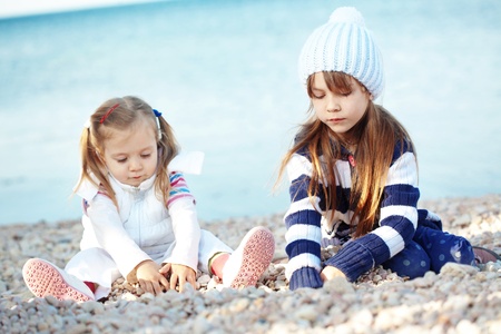 Kids having fun at the beachの写真素材