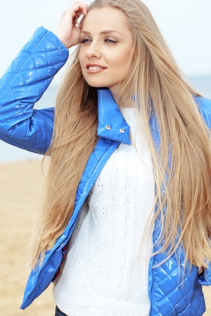 Beautiful young woman resting at the beachの写真素材