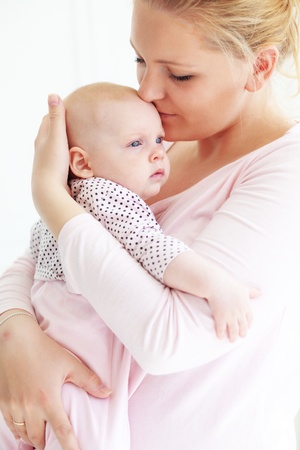 Portrait of a mother with her little babyの写真素材
