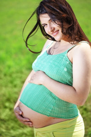 Portrait of beautiful pregnant woman outdoorsの写真素材