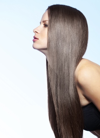 Studio portrait of a model showing her healthy shining hairの写真素材
