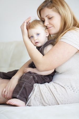 Mother playing with her toddler child at homeの写真素材