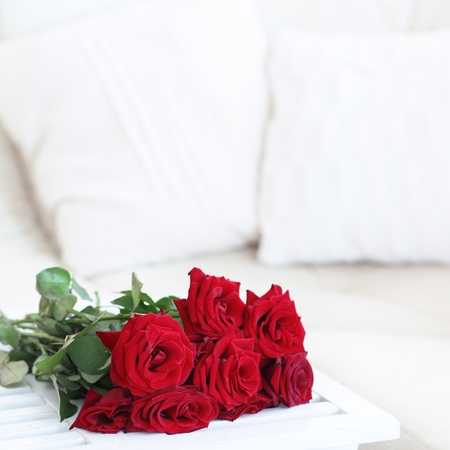 Bouquet of red roses in a room selective focusの写真素材