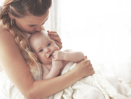 Portrait of a mother with her 3 monthes old babyの写真素材