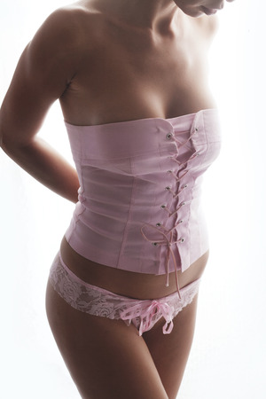 Closeup photo of beautiful woman body isolated on white backgroundの写真素材