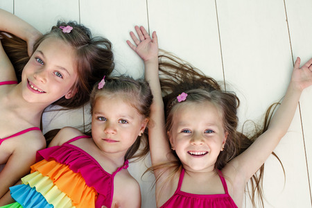 Three children closeup top view pointの写真素材