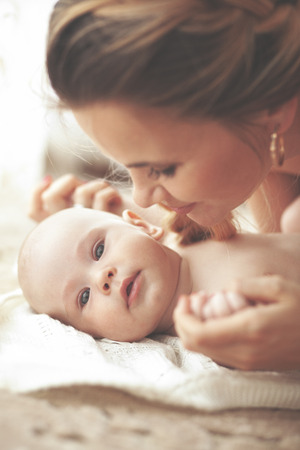 Portrait of a mother with her 3 monthes old babyの写真素材