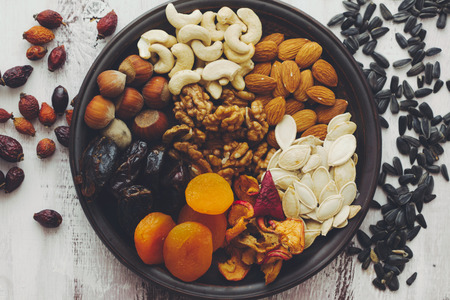 Variety of 12 assorted nuts and dried fruits, top view
