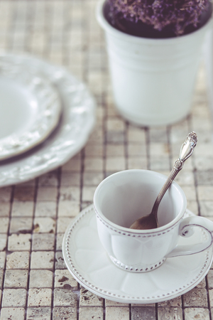 Spring shabby chic table setting on mosaic stone backgroundの写真素材