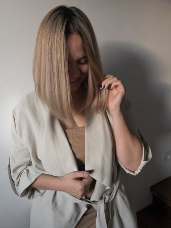 Plus size model with with straight shiny hair after salon care. Woman bob haircut styling.の写真素材