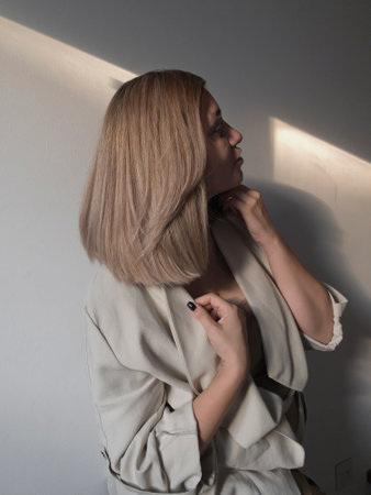 Plus size model with with straight shiny hair after salon care. Woman bob haircut styling.の写真素材
