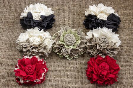 Beautiful letter H made of handmade flowers on a linen canvasの写真素材