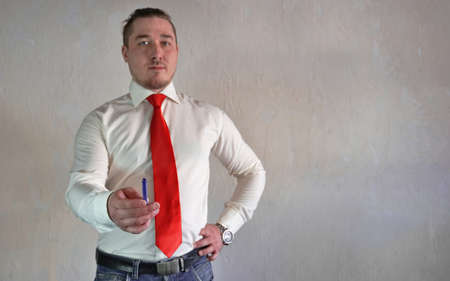 Friendly and smiling businessman looking at camera with reliability isolated on white backgroundの写真素材