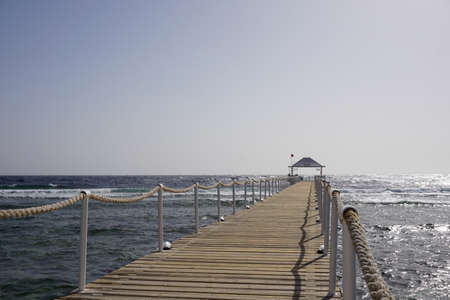 Old wood bridge pier against beautiful sunset sky use for natural backgroundの写真素材