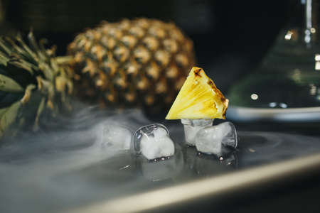 Hookah hot coals on shisha bowl with black background. Stylish oriental shisha. a pineappleの写真素材