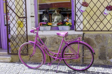 Retro style purple bicycle near the souvenir shop.の写真素材