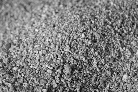 Closeup of sand on the beach. Crystals of sea sand as background. Macro black and whiteの写真素材