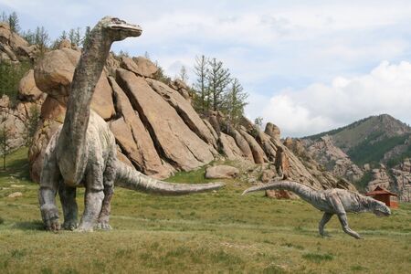 Stone dinosaurs in the background of the mountains in Mongoliaのeditorial素材