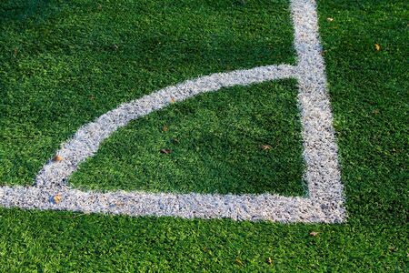 Green artificial turf football and markings near the corner flag