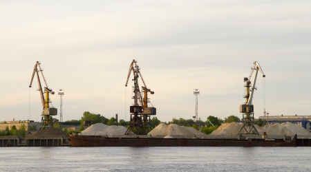 View of harbor cranes from a boat, floating on the river Volgaのeditorial素材