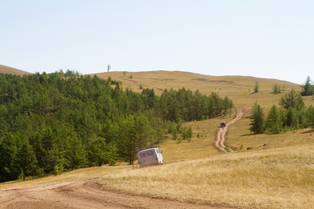 Minibuses with tourists on the tourist route around the island of Olkhonのeditorial素材