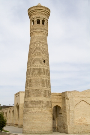 Near the famous minaret of a mosque in Bukhara, Uzbekistanの写真素材