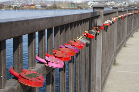 Padlock on the fence on the embankment of the Angara Riverのeditorial素材