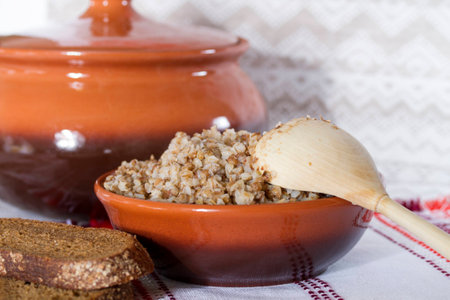 Boiled buckwheat porridge in a ceramic bowlの写真素材