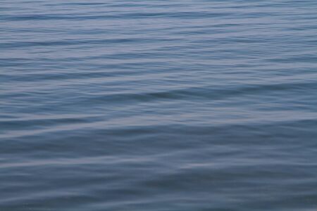 The water surface of Lake Baikal in the backgroundの写真素材