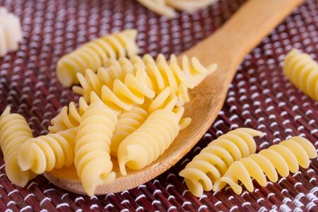 Pasta in a wooden spoonの写真素材