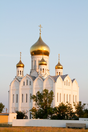 Orthodox Church in the sunset in the village of Priazovskiyの写真素材