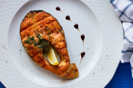 Grilled humpback salmon with a lemon sliceの写真素材