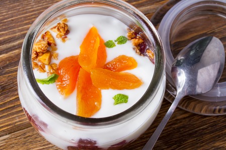 Dietary breakfast of muesli, nuts and whipped creamの写真素材