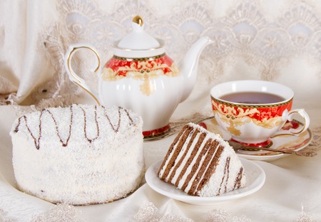 Cake with chocolate shortcakes, stuffed with whipped cream and a dusting of coconutの写真素材