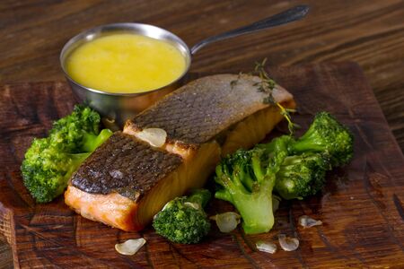 Grilled salmon steak with broccoliの写真素材
