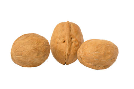 three isolated walnuts on a white background