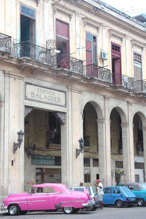 Havana, Cuba, July 17, 2017. The old Balaguer building and its street parking.のeditorial素材