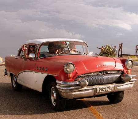 Havana, Cuba, July 18, 2017. The colors and style of classic American cars stand out anywhere in the city.のeditorial素材